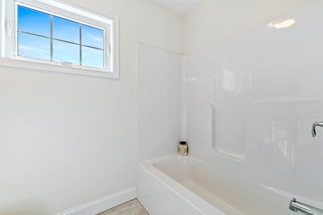 bathroom with tile patterned flooring and baseboards