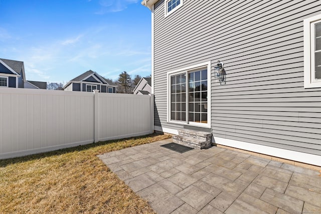 view of patio featuring entry steps and a fenced backyard