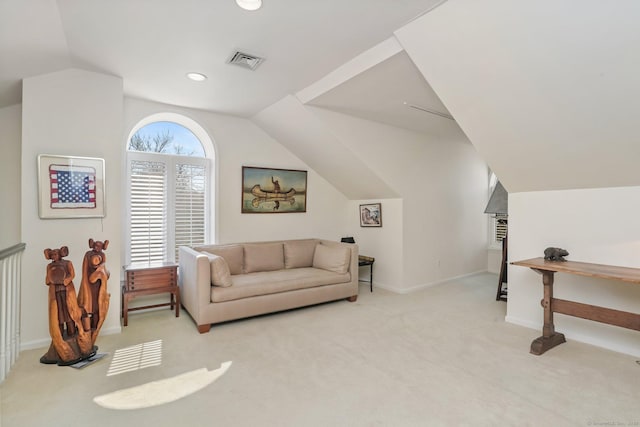 living area with carpet floors, baseboards, lofted ceiling, and visible vents