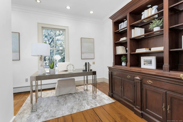 office area featuring a baseboard heating unit, light wood finished floors, ornamental molding, and recessed lighting