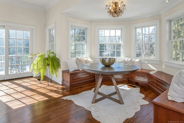 sunroom / solarium with a notable chandelier