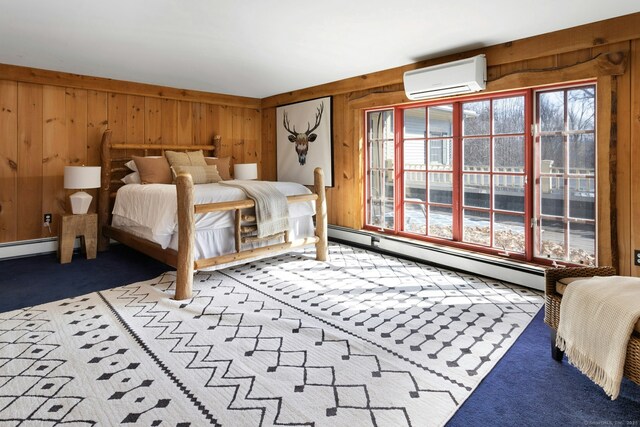 bedroom with wood walls, a wall mounted air conditioner, carpet flooring, and a baseboard radiator