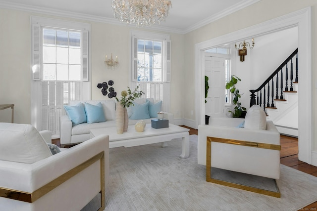 interior space featuring baseboards, stairway, ornamental molding, wood finished floors, and a notable chandelier