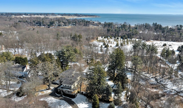 snowy aerial view featuring a water view