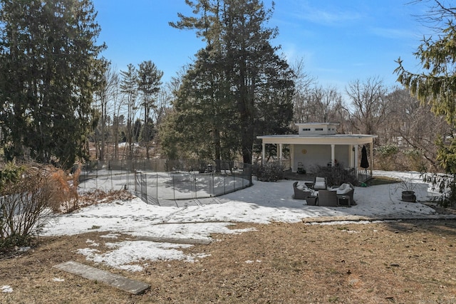 342 Greens Farms Rd, Westport, CT 06880 - yard covered in snow featuring a patio area and fence