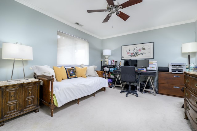 bedroom featuring ornamental molding, light colored carpet, visible vents, and a ceiling fan