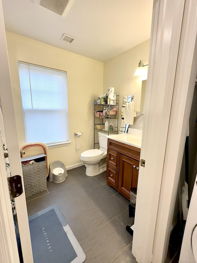 18 Soundview Ave, Norwalk, CT 06854 - bathroom featuring visible vents, toilet, vanity, and baseboards