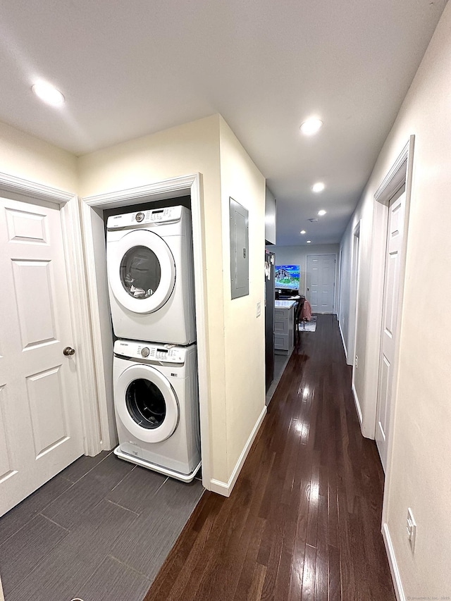 18 Soundview Ave, Norwalk, CT 06854 - washroom featuring dark wood-style flooring, laundry area, stacked washer and clothes dryer, and electric panel