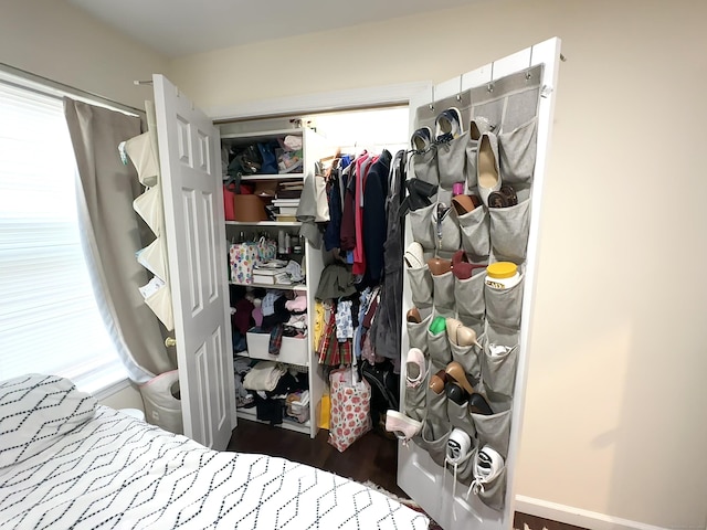 18 Soundview Ave, Norwalk, CT 06854 - bedroom featuring a closet, multiple windows, and wood finished floors