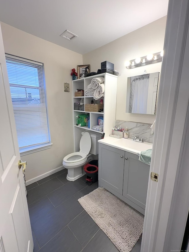 18 Soundview Ave, Norwalk, CT 06854 - bathroom featuring vanity, baseboards, tile patterned floors, toilet, and visible vents