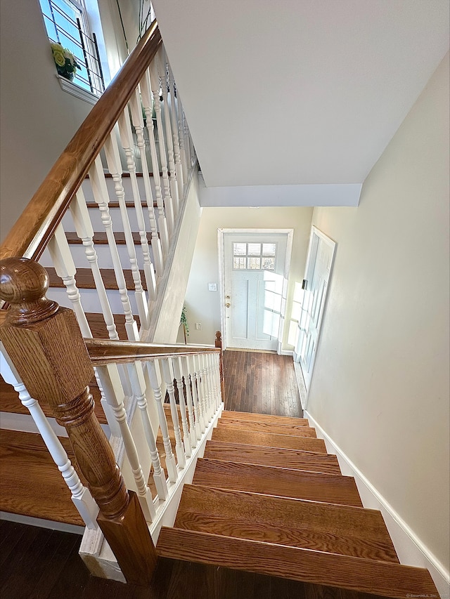 18 Soundview Ave, Norwalk, CT 06854 - staircase featuring a high ceiling, wood finished floors, and baseboards