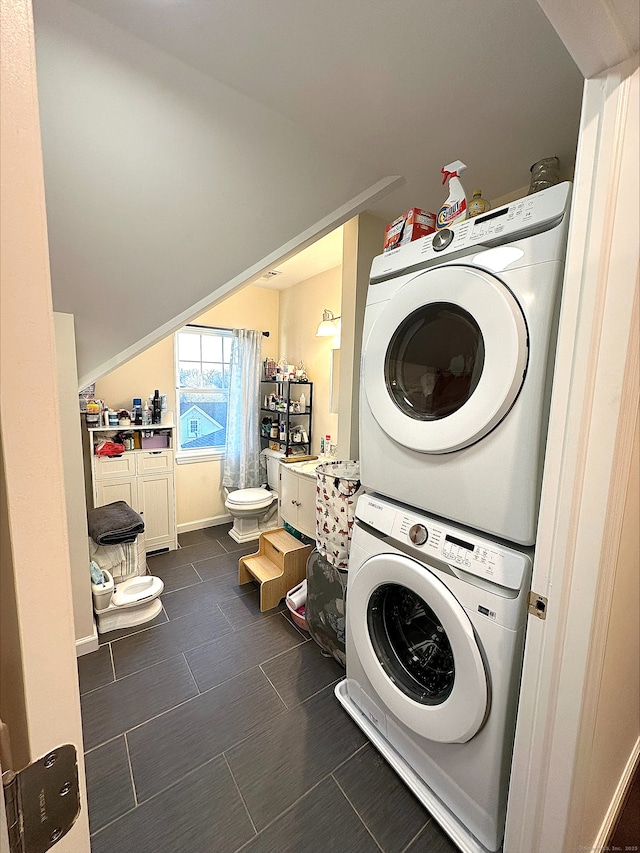 18 Soundview Ave, Norwalk, CT 06854 - clothes washing area featuring baseboards, stacked washer and dryer, and laundry area
