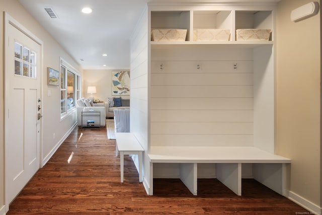 mudroom featuring dark wood-type flooring, visible vents, and recessed lighting