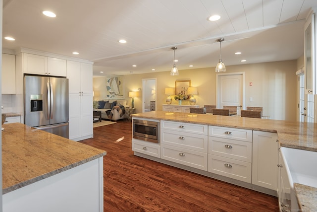 kitchen with white cabinets, dark wood-style floors, stainless steel appliances, and recessed lighting