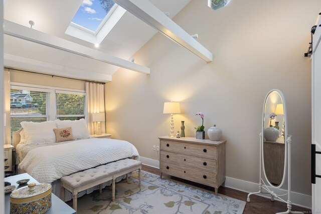 bedroom featuring high vaulted ceiling, a skylight, baseboards, and wood finished floors