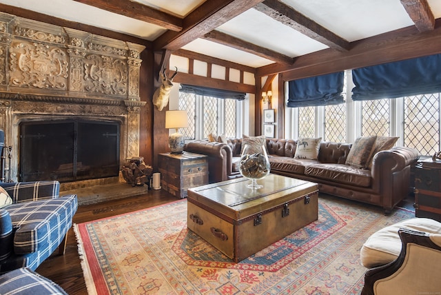 living room with a fireplace, wood finished floors, and beamed ceiling