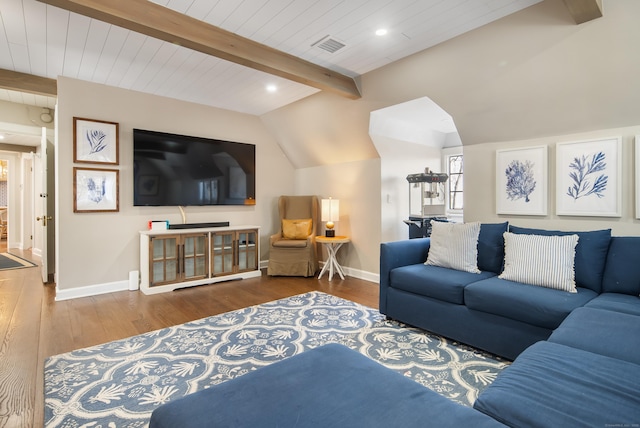 living area with vaulted ceiling with beams, recessed lighting, wood finished floors, visible vents, and baseboards