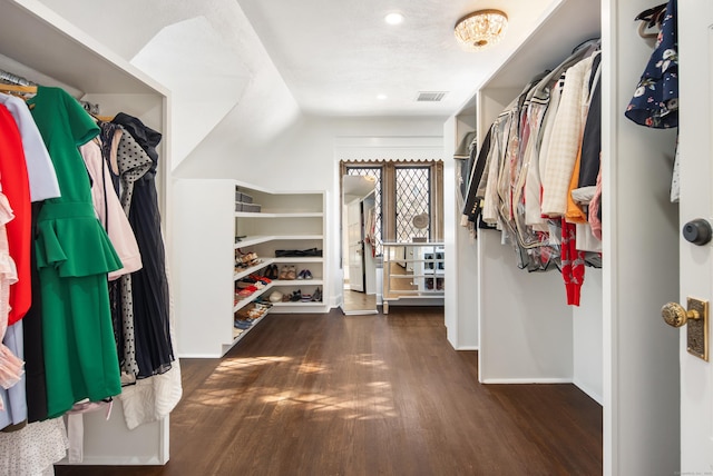 walk in closet featuring wood finished floors and visible vents