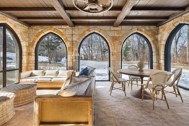 snow covered patio with an outdoor hangout area and outdoor dining space