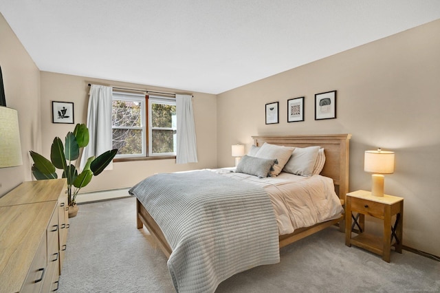 bedroom featuring a baseboard radiator, light carpet, and baseboards