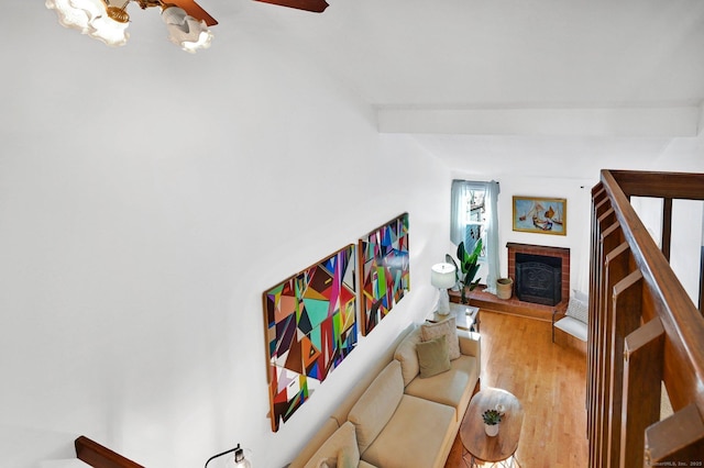 living area featuring a fireplace and wood finished floors