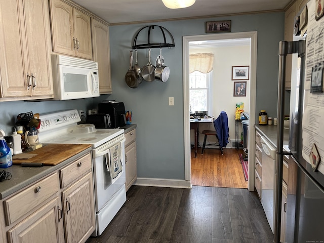 kitchen featuring white appliances, baseboards, dark wood-type flooring, and light brown cabinetry