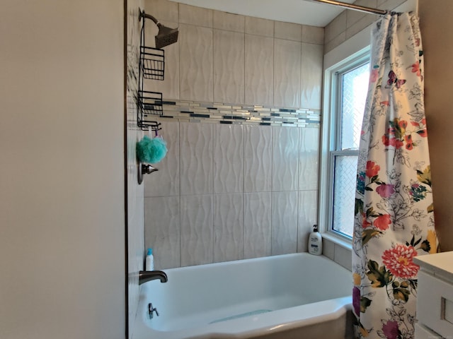 bathroom with shower / bath combo