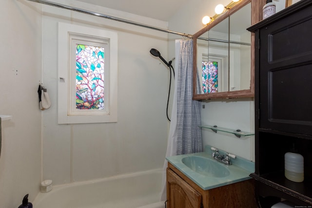 bathroom featuring shower / tub combo with curtain and vanity