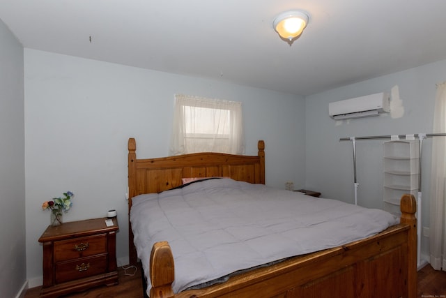 bedroom featuring a wall mounted air conditioner