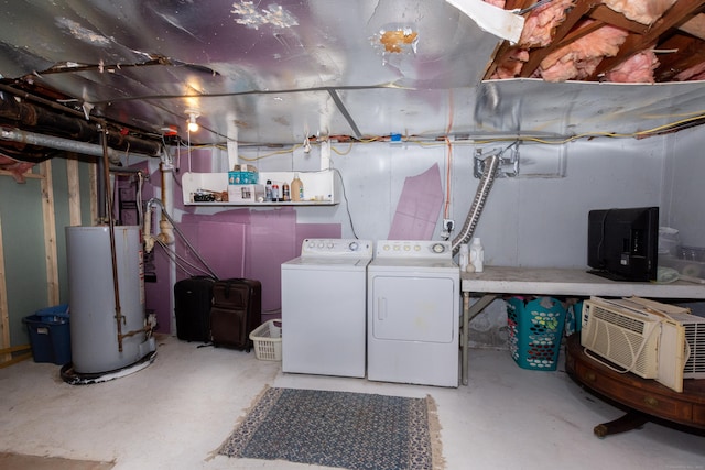 unfinished basement with a wall mounted AC, gas water heater, and washing machine and clothes dryer