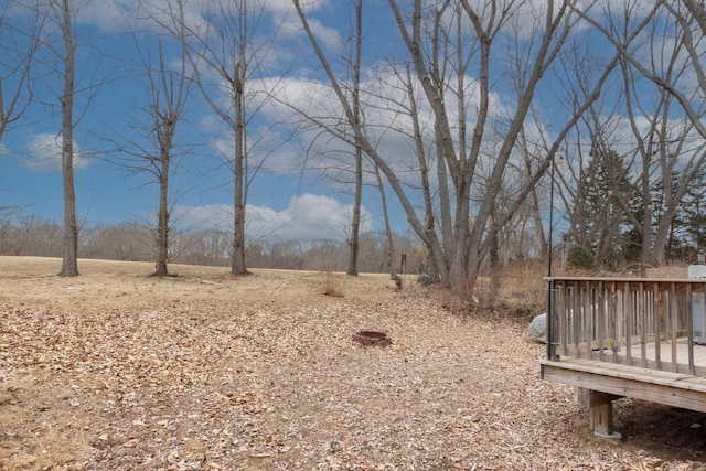 view of yard featuring a wooden deck