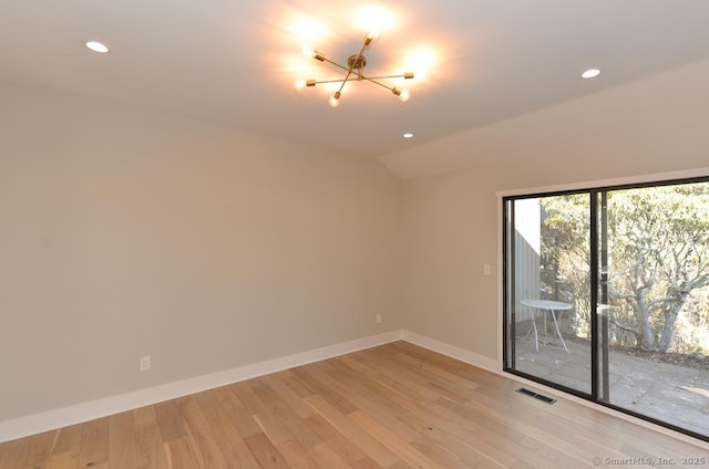 empty room featuring lofted ceiling, recessed lighting, visible vents, baseboards, and light wood-type flooring