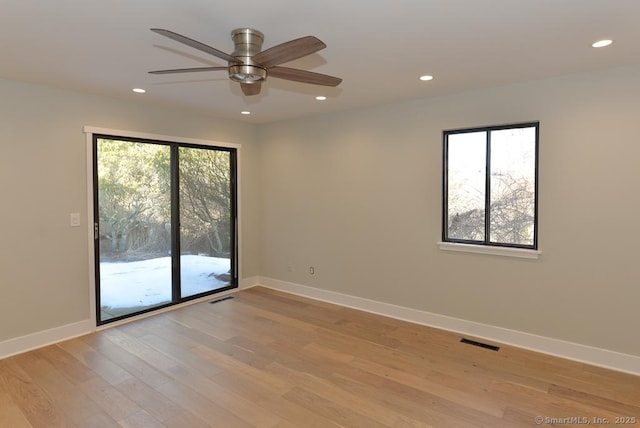 unfurnished room featuring visible vents, a ceiling fan, light wood-style flooring, and recessed lighting