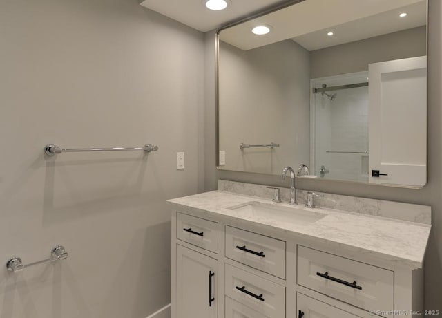 bathroom with vanity and recessed lighting