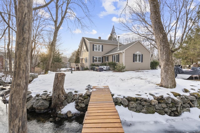 view of snow covered house