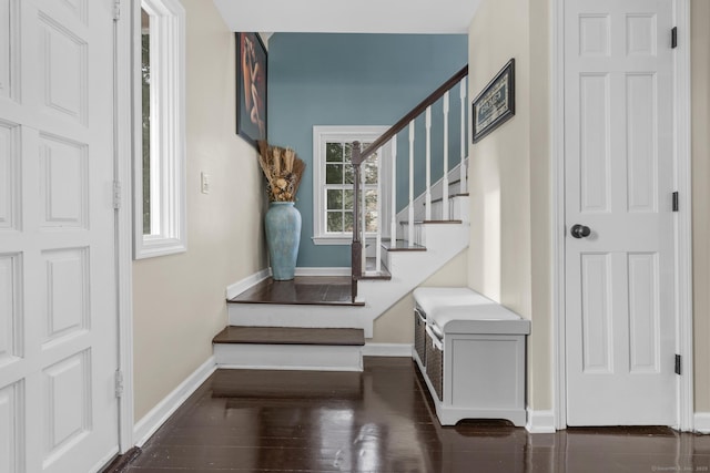 stairs with baseboards and wood finished floors