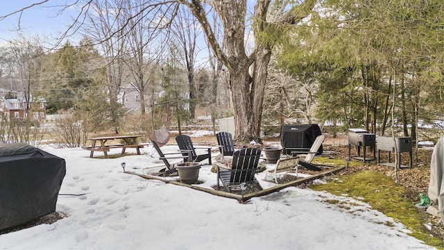 snow covered patio featuring area for grilling