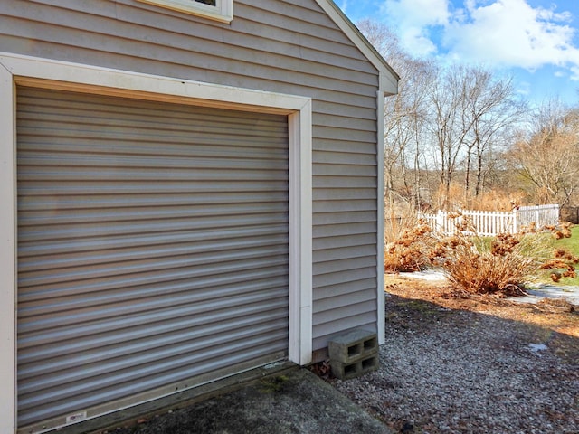 view of outbuilding with fence