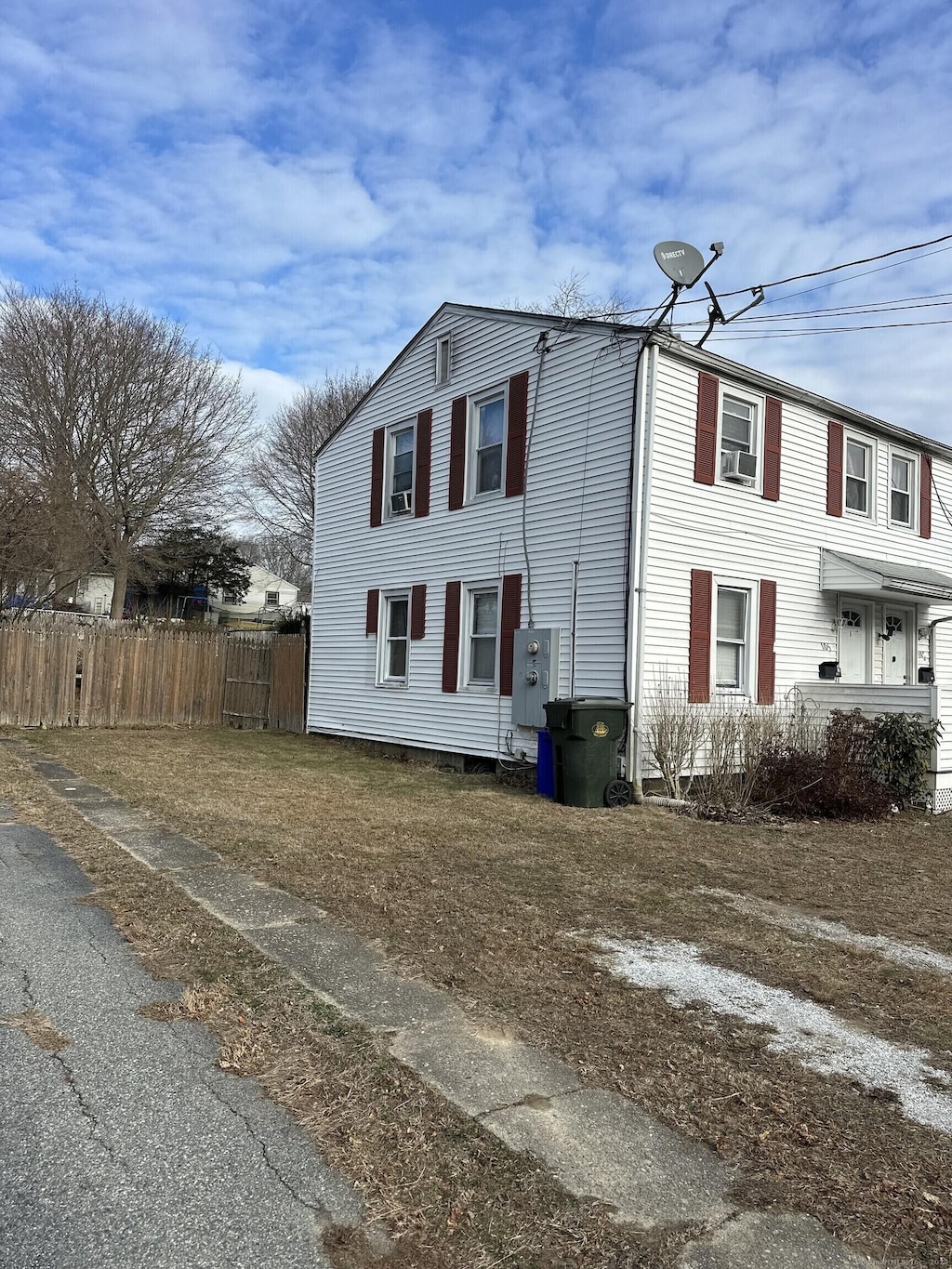 view of property exterior with fence