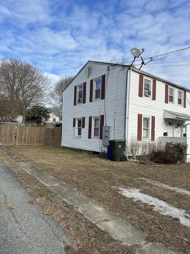 view of property exterior with fence