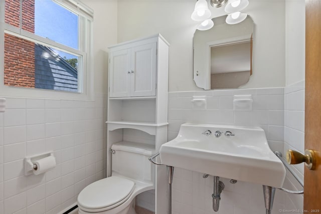 29 Maplewood Dr, Greenwich, CT 06807 - bathroom with tile walls, wainscoting, toilet, and a baseboard heating unit