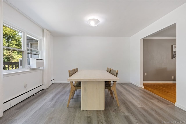 29 Maplewood Dr, Greenwich, CT 06807 - dining room featuring a baseboard heating unit, wood finished floors, baseboards, cooling unit, and ornamental molding