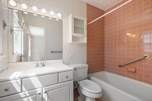 29 Maplewood Dr, Greenwich, CT 06807 - bathroom with wallpapered walls, toilet, vanity, and shower / bath combination
