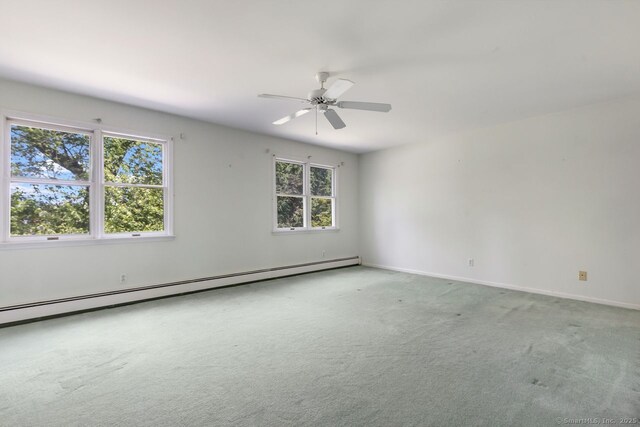29 Maplewood Dr, Greenwich, CT 06807 - spare room with baseboard heating, carpet flooring, baseboards, and a ceiling fan