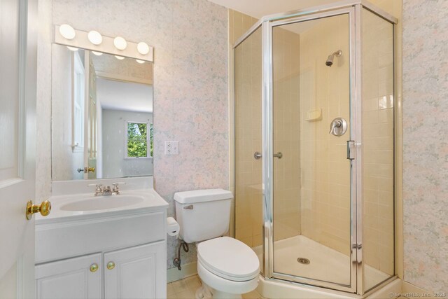 29 Maplewood Dr, Greenwich, CT 06807 - full bath with wallpapered walls, a shower stall, vanity, and toilet