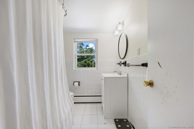 29 Maplewood Dr, Greenwich, CT 06807 - bathroom with a baseboard heating unit, tile patterned flooring, vanity, toilet, and a wainscoted wall