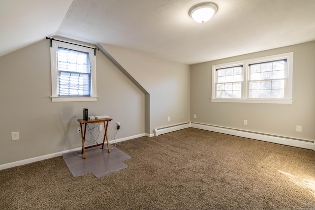 bonus room featuring vaulted ceiling, carpet, a baseboard radiator, and baseboards