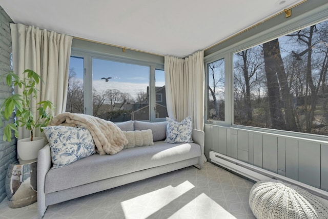 sunroom with a baseboard heating unit