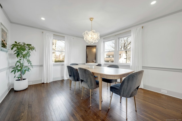 dining area featuring dark wood-type flooring, recessed lighting, baseboards, and a chandelier