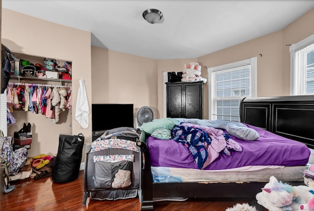 bedroom with wood finished floors